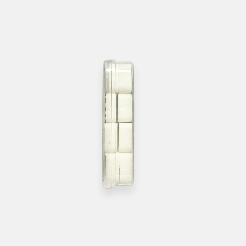 A single pack of Droolrz candy on its side showing the two layers of candy while on a plain grey background